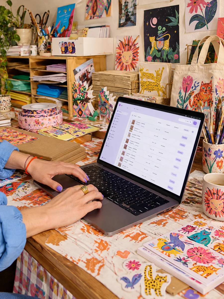 An artist designing at her desk